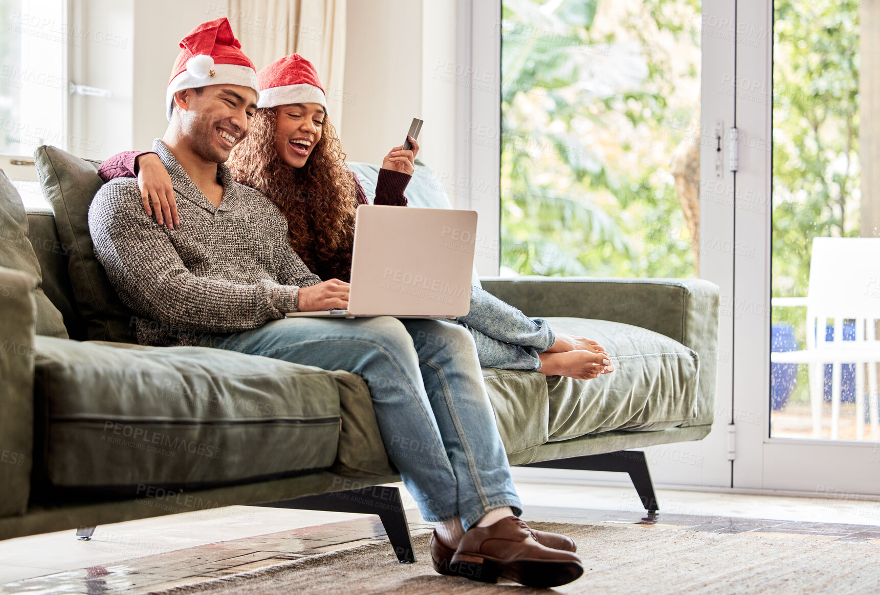 Buy stock photo Online shopping, couple and laptop for Christmas on sofa for gifts, ecommerce and happy together at home. Excited woman, couch and man with purchase, payment and credit card with hug in living room