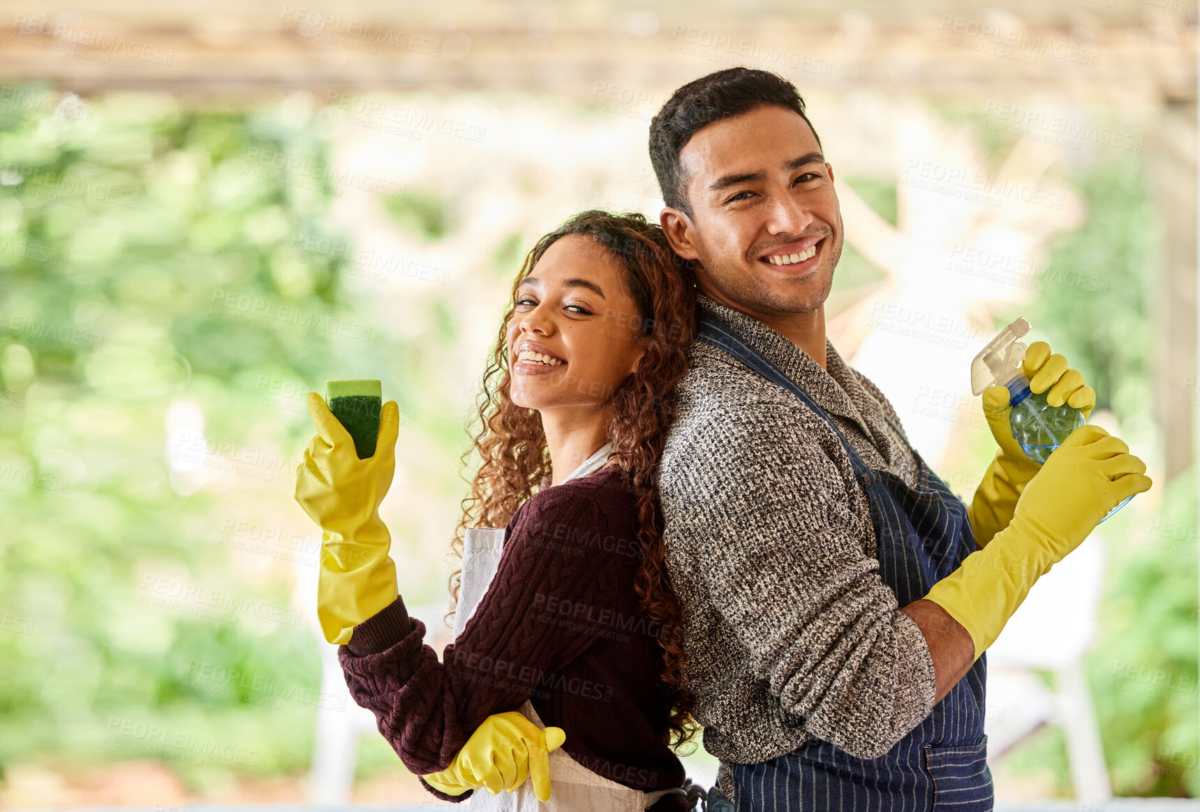 Buy stock photo Shot of a young couple cleaning at home