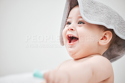 Buy stock photo Shot of an adorable little boy playing on his bed at home
