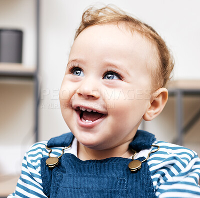 Buy stock photo Shot of an adorable little boy looking happy at home