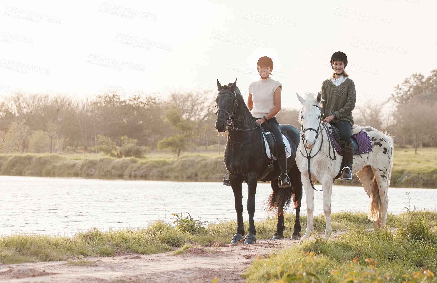 Buy stock photo Portrait, women and horses in countryside for riding, freedom and recreation for adventure for friends. Farm, females equestrian and stallion for training, sports and bonding with animals by river