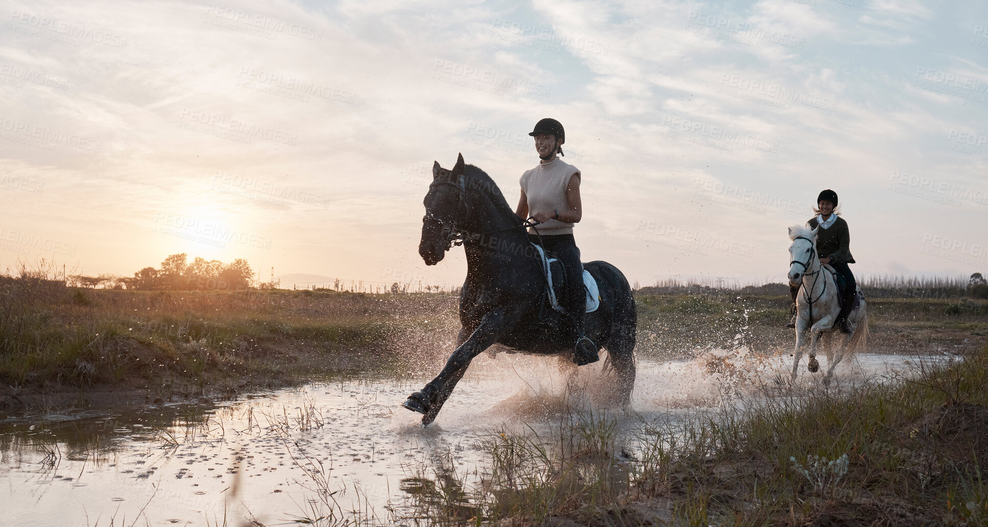 Buy stock photo Equestrian, horse riding and water with friends in countryside together for saddle training. Environment, sports and sunset with people on horseback for adventure, journey or travel in nature