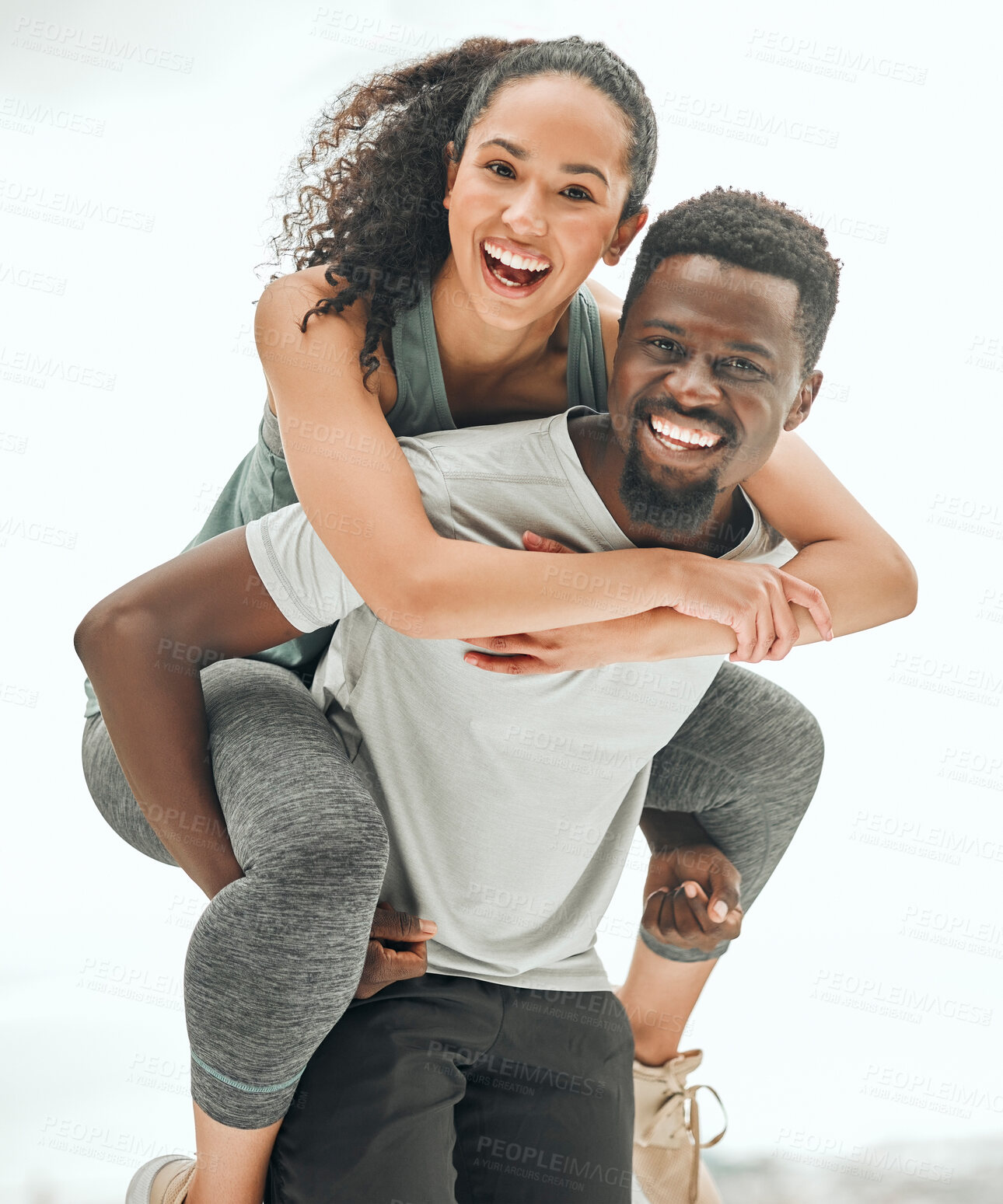 Buy stock photo Happy people in portrait, piggyback and hiking outdoor with smile, fun and fitness with interracial couple. Excited, workout together and trekking, black man and woman are playful with happiness