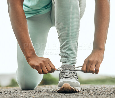 Buy stock photo Shoes, running and a sports woman tying laces outdoor during a fitness workout for endurance or cardio. Exercise, health and training with a female athlete fastening footwear in preparation of a run