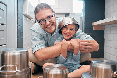 Buy stock photo Shot of a father and son in the kitchen