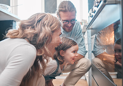 Buy stock photo Shot of a little girl and her parents sitting in front of the oven
