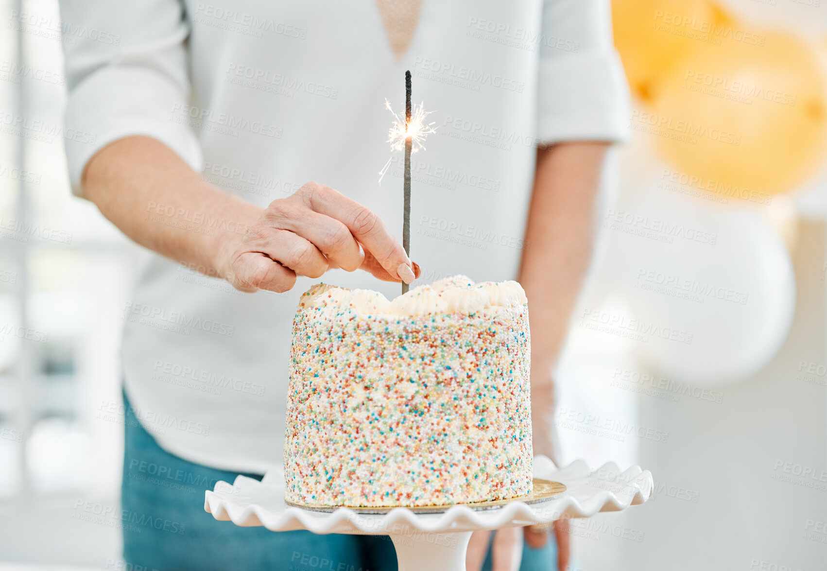Buy stock photo Shot of an unrecognisable woman celebrating a birthday at home