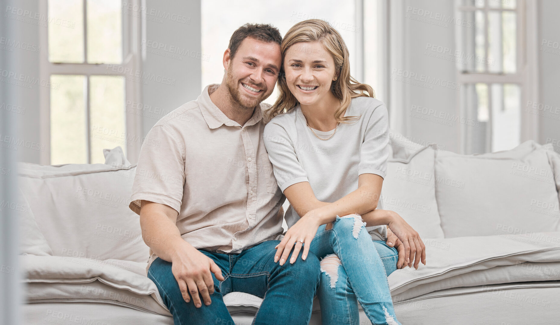 Buy stock photo Portrait, couple and together on couch with smile for love, support and comfort in apartment. Man, woman and bonding in home for weekend, relax and happy or pride for relationship or marriage on sofa