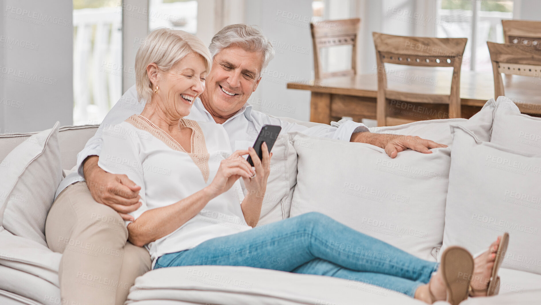 Buy stock photo Relax, mobile and senior couple on sofa for social media, browsing internet or reading article in living room. Online, happy woman and elderly man for love, retirement or entertainment in home