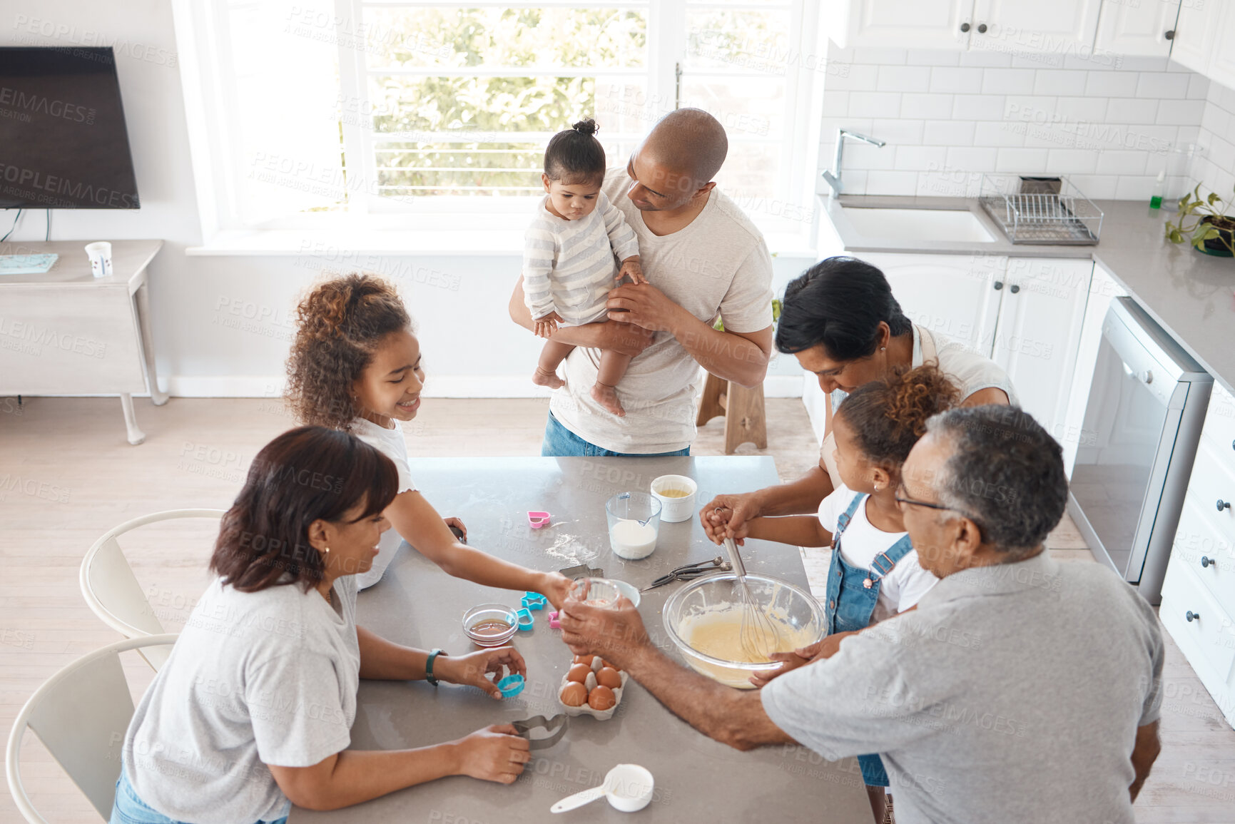 Buy stock photo Family, kitchen and ingredients for baking together in home, teaching grandchildren and cooking. People, helping and education for child development, generations bonding and above support for meal