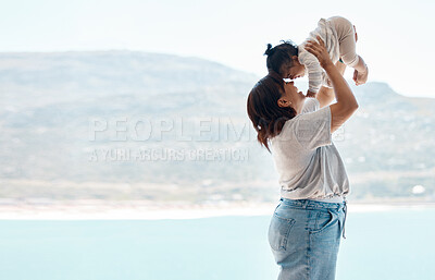 Buy stock photo Shot of a young woman playing with baby daughter