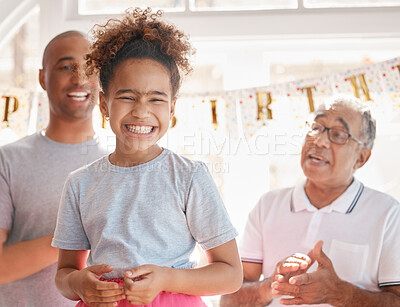 Buy stock photo Shot of a little girl enjoying a birthday party with her family at home