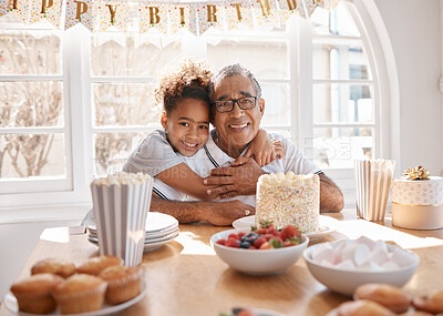 Buy stock photo Shot of a Grand daughter hugging her grandpa during a birthday party at home
