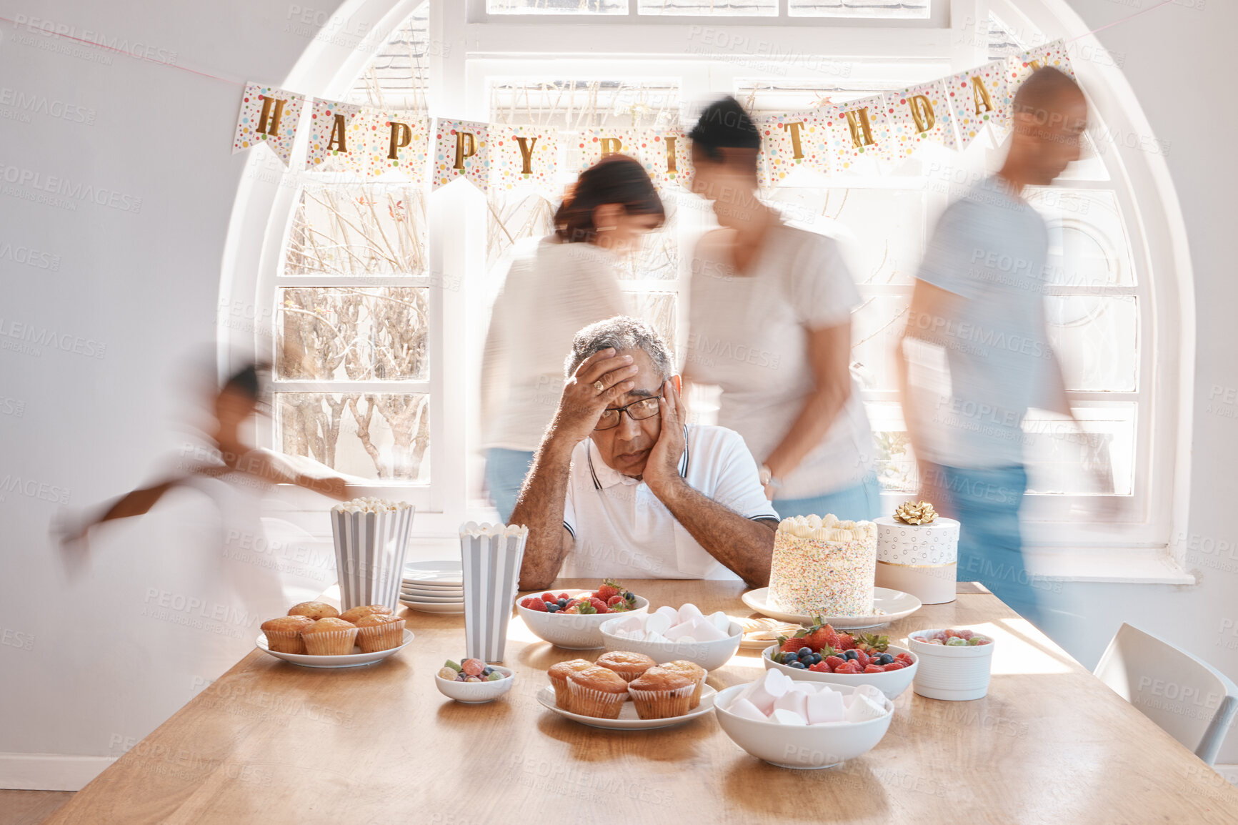Buy stock photo Shot of a senior man looking lonely while celebrating his birthday alone at home