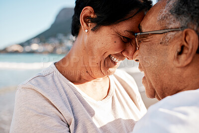 Buy stock photo Shot of a mature couple spending time at the beach