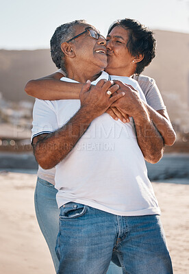 Buy stock photo Shot of a mature couple spending time at the beach