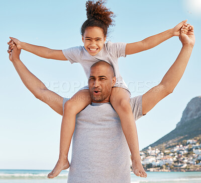 Buy stock photo Shot of a little girl and her father spending time at the beach