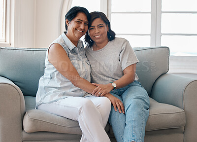 Buy stock photo Shot of a young woman spending time with her mother at home