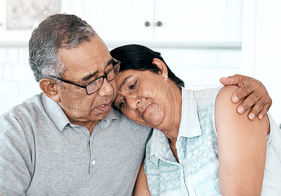 Buy stock photo Home, hug and senior couple with comfort, sad and empathy with problems, retirement and care. Partners, mature woman or elderly man embrace, depression or unhappy in the kitchen with grief or support