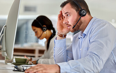 Buy stock photo Shot of two business people working together in a call center