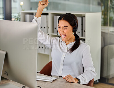 Buy stock photo Shot of a young businesswoman cheering while working in a call center