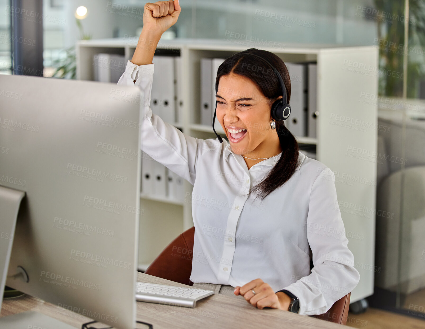 Buy stock photo Woman, call center and microphone in celebration for success in workplace as virtual assistant. Sales representative, female person and fist with excited, technology and happy for achievement in work