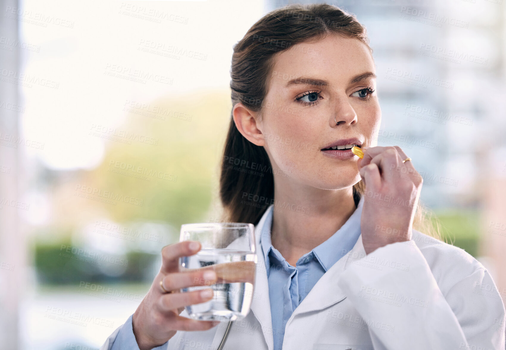 Buy stock photo Doctor, drinking water or woman in hospital with pills or supplements for healthcare vitamins or medicine. Stress, medication tablets or sick medical worker taking drugs for depression or headache