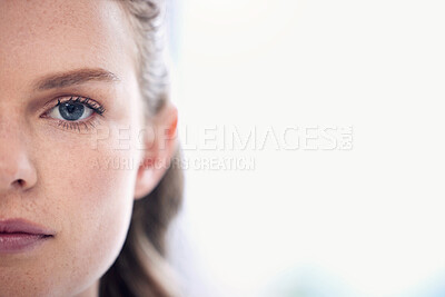 Buy stock photo Woman, focus and half face with a healthy vision for awareness in australia for closeup. Serious, portrait and female person with eyes for concentration with eye test for wellness and seeing.
