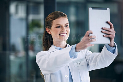 Buy stock photo Doctor, happy woman or selfie at hospital for social media app, profile picture or about us post online. Tablet, smile or medical worker taking photo for blog, internet or web networking in clinic