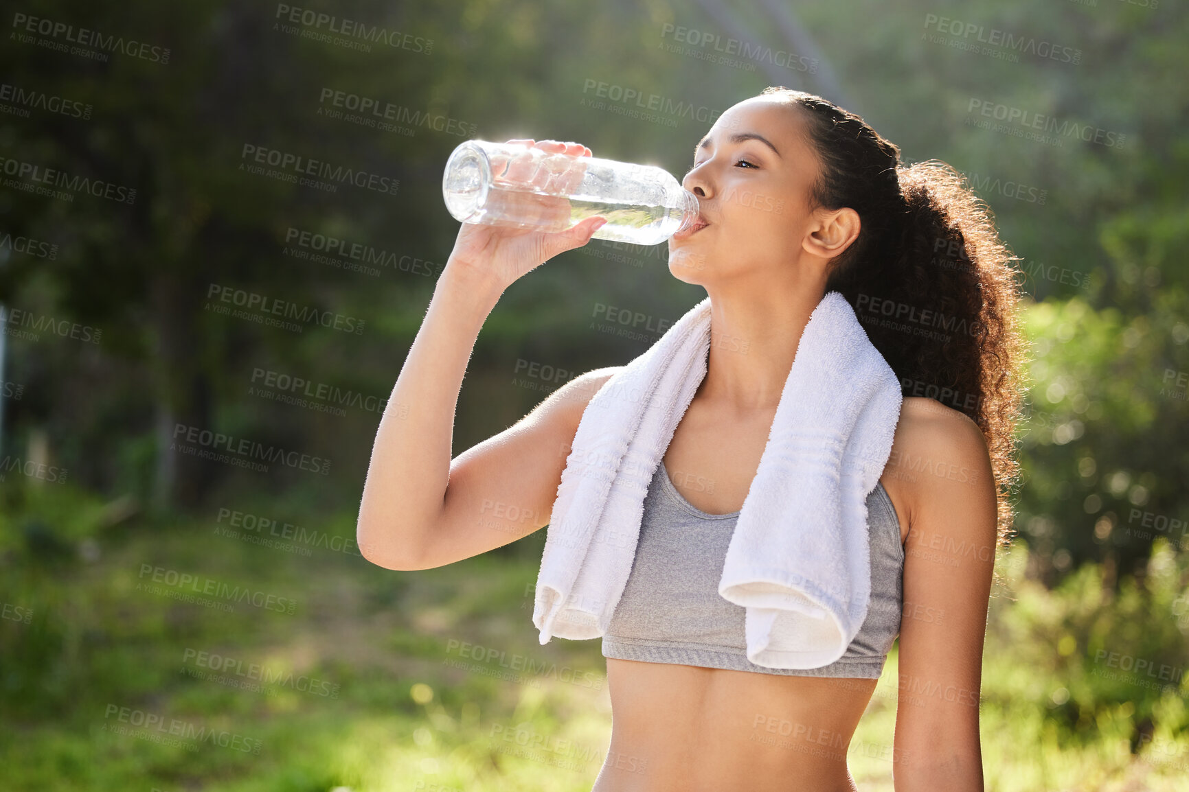 Buy stock photo Park, bottle and drink water for girl with towel, outdoor and exercise for fitness, forest and break in nature. Wellness, healthy and woman in woods, hydration and workout with liquid and athlete