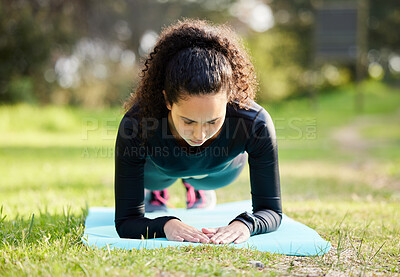 Buy stock photo Shot of a young woman enjoying her morning yoga outside