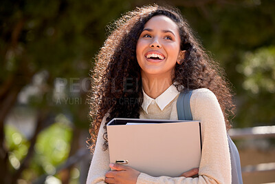 Buy stock photo Shot of an attractive young female student standing outside on campus