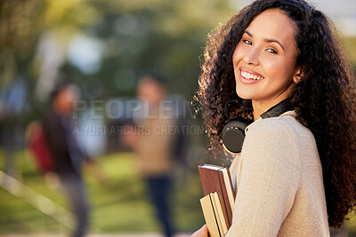 Buy stock photo Portrait of an attractive young female student standing outside on campus