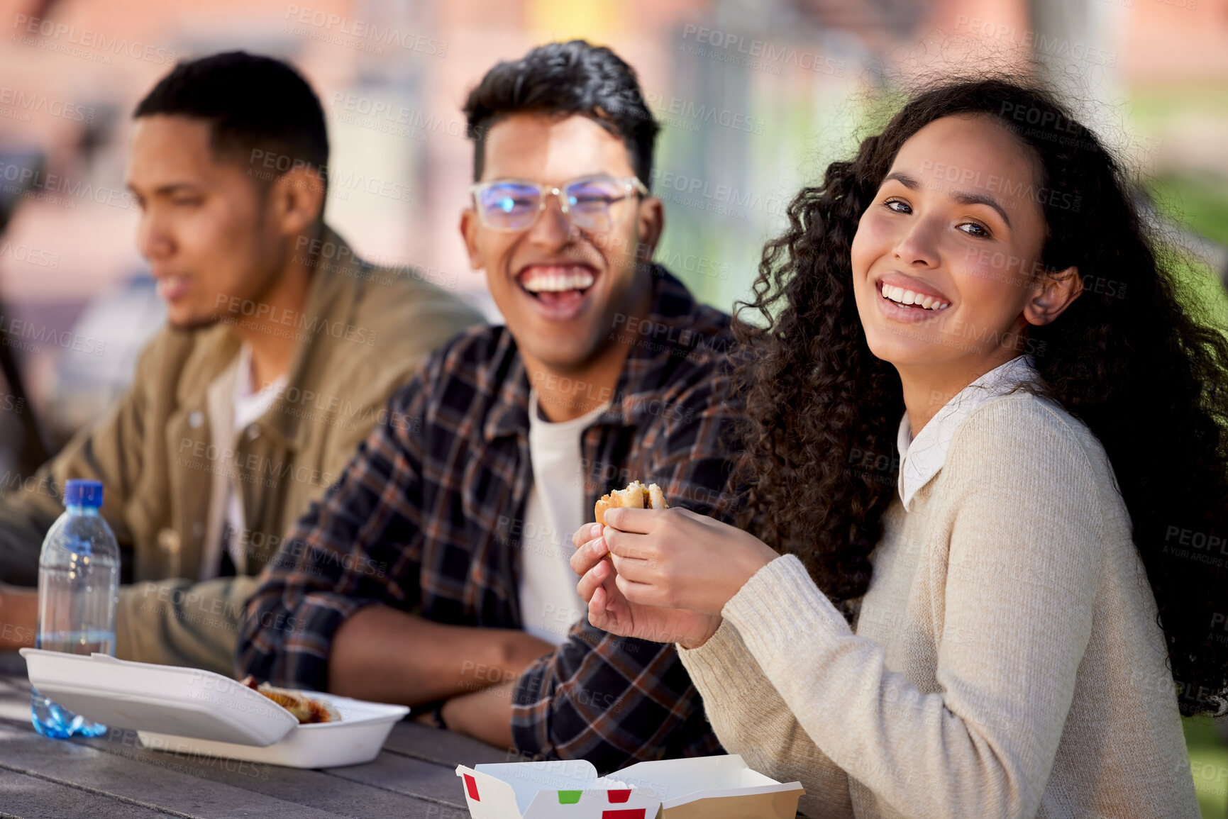Buy stock photo Students, happy and friends eating lunch together on university or college campus for a break as a group. Smile, portrait and group of young people with food, burger or relax in a restaurant