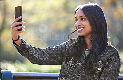 Buy stock photo Young woman, selfie and smile outdoor in park for social media, internet sharing and memories. Happy, female person or student in nature with technology for communication, contact and online post