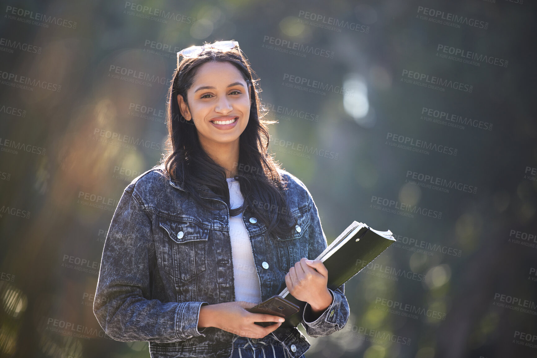 Buy stock photo Happy, woman or student in nature with smartphone and books for commute to college campus. Smile, female person and mobile with notebook for travel, learning and scholarship for university education