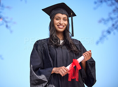 Buy stock photo Portrait of a young woman holding her diploma on graduation day