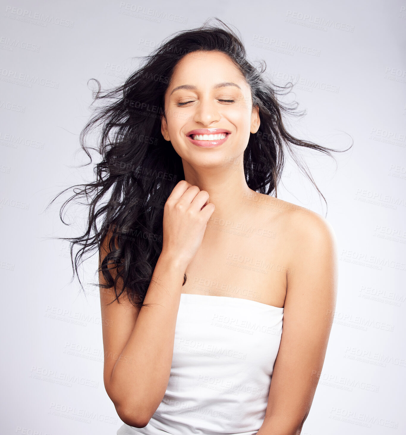 Buy stock photo Woman, smile and hair care with salon, hairdresser and Brazilian serum treatment with wind in studio. Wellness, clean and shine from haircut health and growth with beauty and white background