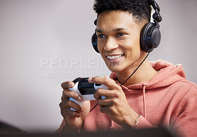 Buy stock photo Gamer, happy and gaming with headphones, smile and confidence in house for esports, winning and battle. Man, excited and controller with console for user experience or live video streaming challenge