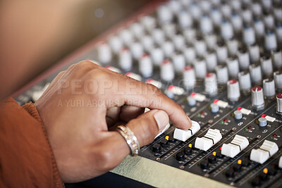 Buy stock photo Rearview shot of an unrecognizable male music producer working on his mix in the office