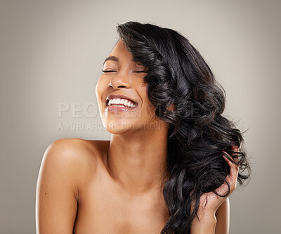 Buy stock photo Beauty, hair and smile with face of woman in studio on gray background for aesthetic or wellness. Haircare, health and natural skincare with happy model at salon or spa for cosmetics or dermatology