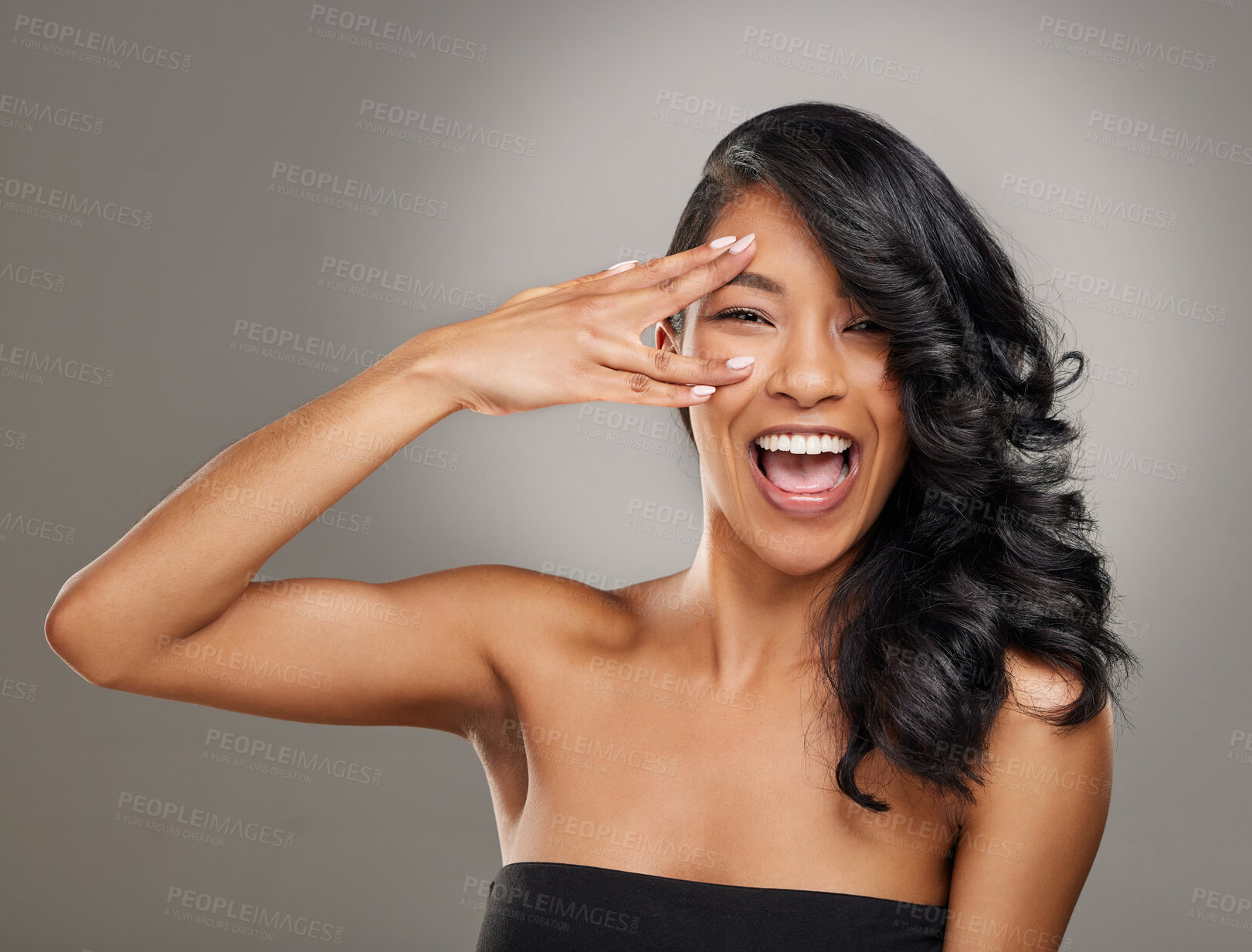 Buy stock photo Beauty, excited and smile with portrait of woman in studio on gray background for aesthetic or wellness. Face, hand and skincare with happy model at salon or spa for cosmetics or dermatology