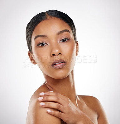 Buy stock photo Studio portrait of an attractive young woman posing against a grey background