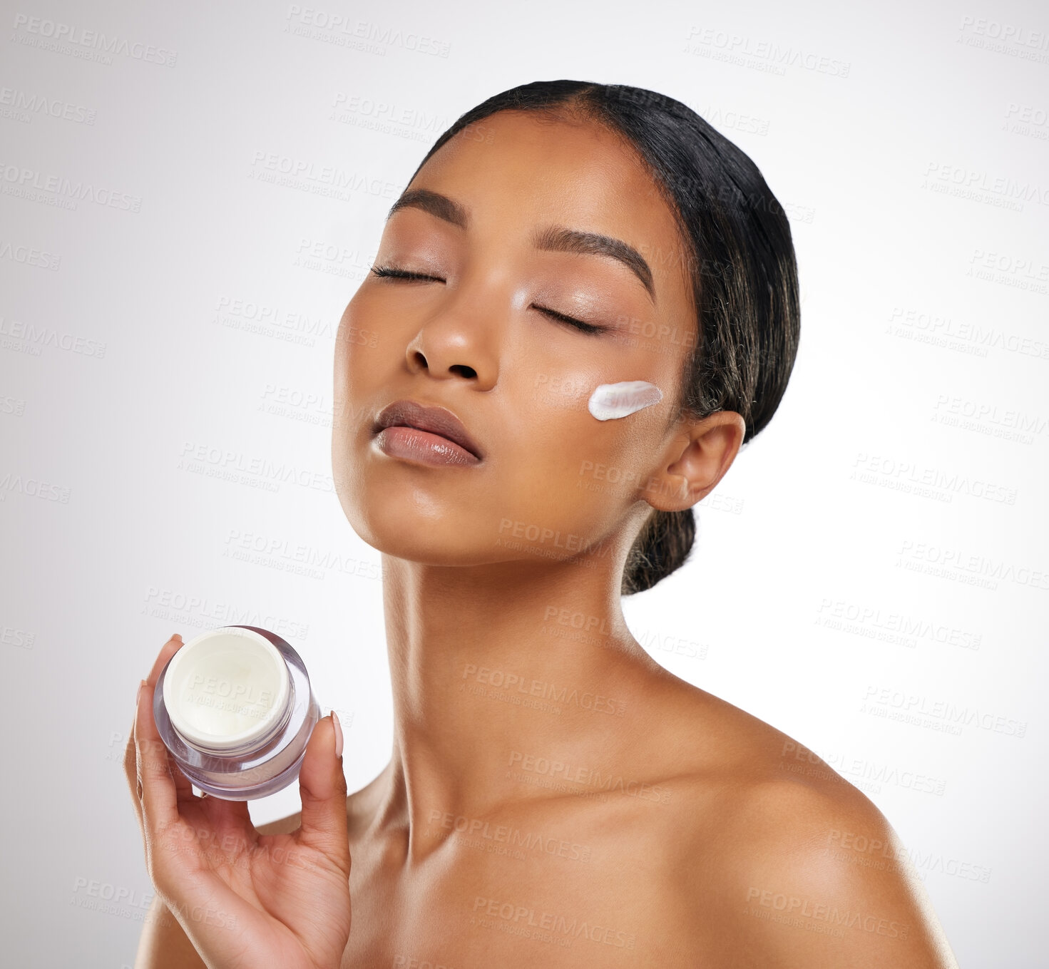 Buy stock photo Skincare, container and woman with cream in studio for skin hydration, anti aging and collagen. Face, female model and cosmetics with girl for smooth, soft texture or glow by white background