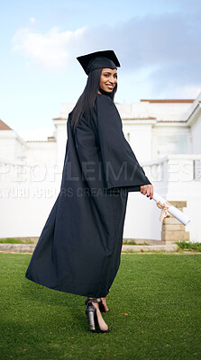 Buy stock photo Portrait of a young woman holding her diploma on graduation day