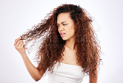 Buy stock photo Anger, beauty and hair with black woman in studio on white background for shampoo treatment. Damage, fail or knot and frustrated model with grooming or haircare problem for cosmetics and keratin