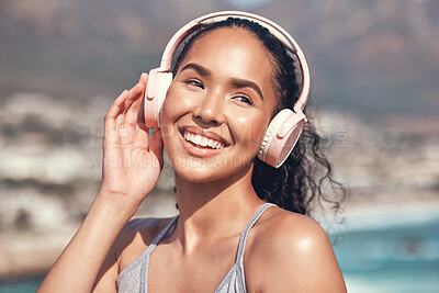 Buy stock photo Shot of a young woman listening to music before a workout