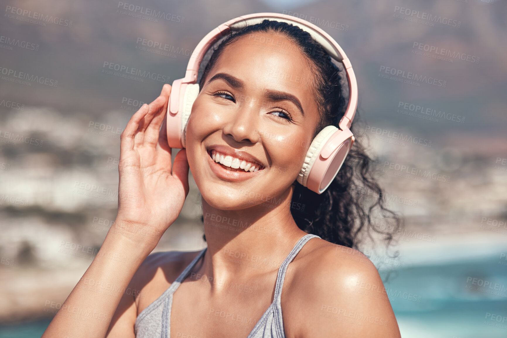 Buy stock photo Shot of a young woman listening to music before a workout