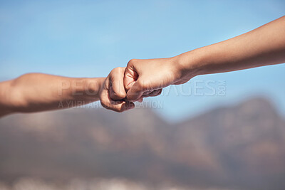 Buy stock photo Shot of two workout partners fist bumping one another
