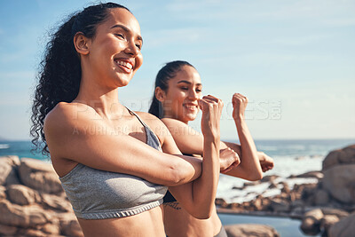 Buy stock photo Shot of two friends stretching before a workout